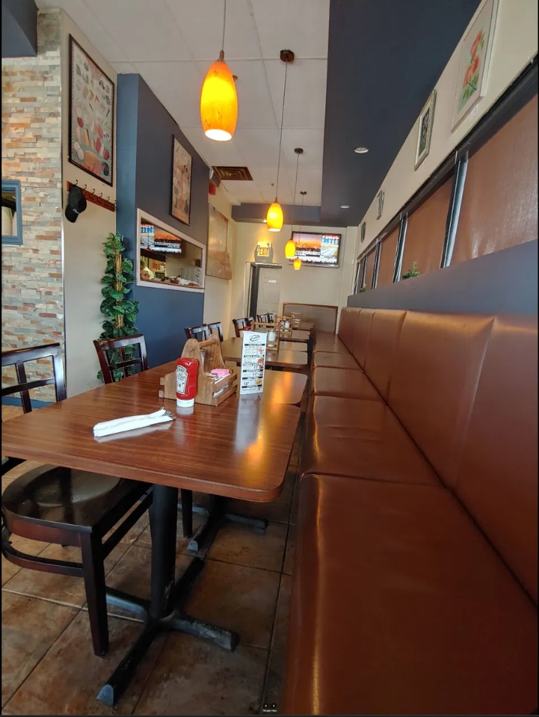 Cozy dining booth seating table at Westney's
